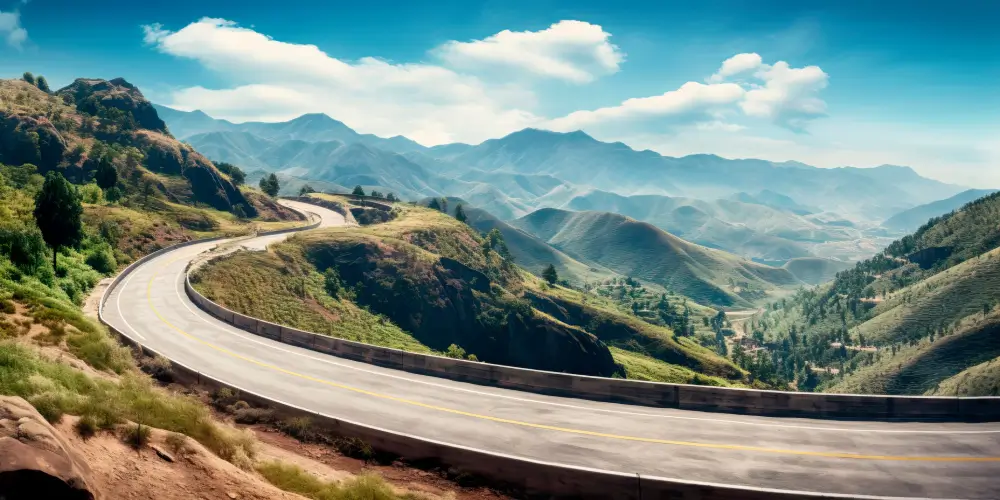 winding road over looking a cliff and mountains